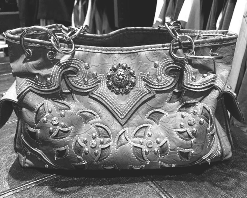 balck and white picture of leather handbag