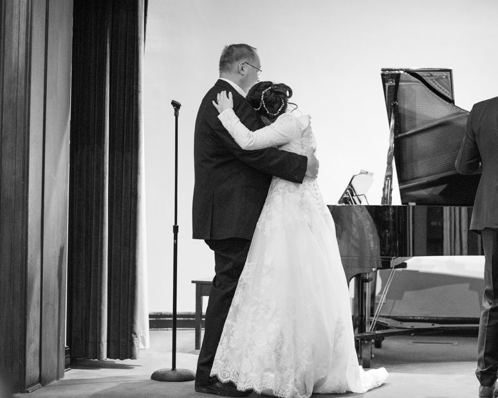 black and white photo father daughter dance